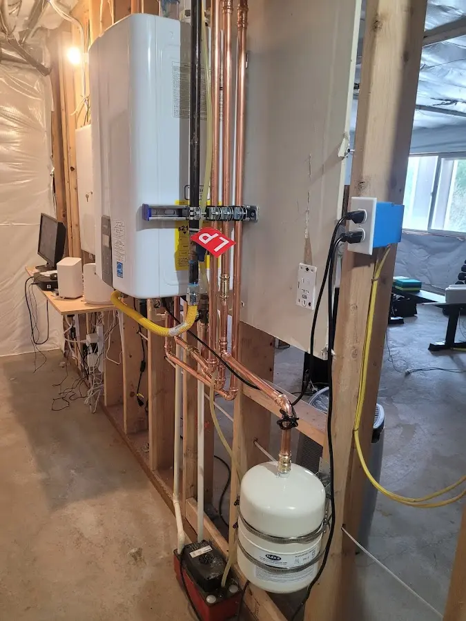 Licensed plumber repairing a kitchen sink in Brillion